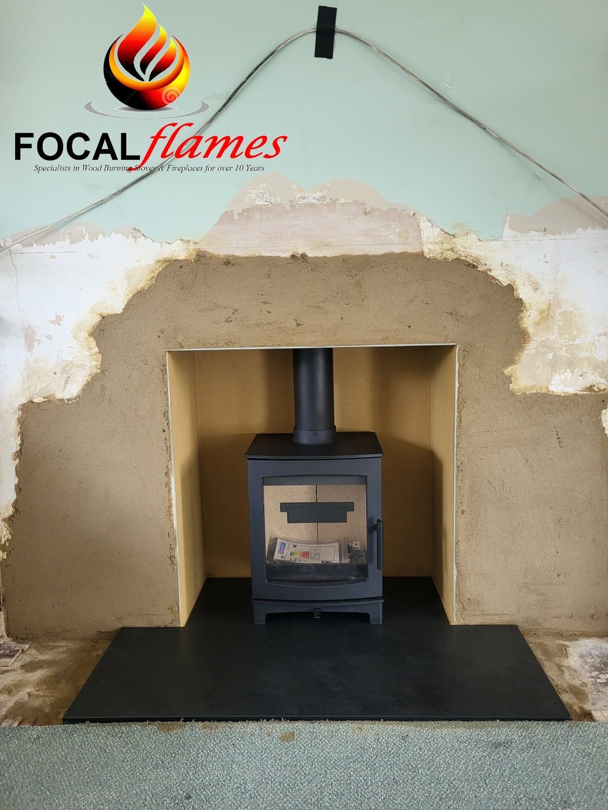A new stove and hearth before the plaster is finished