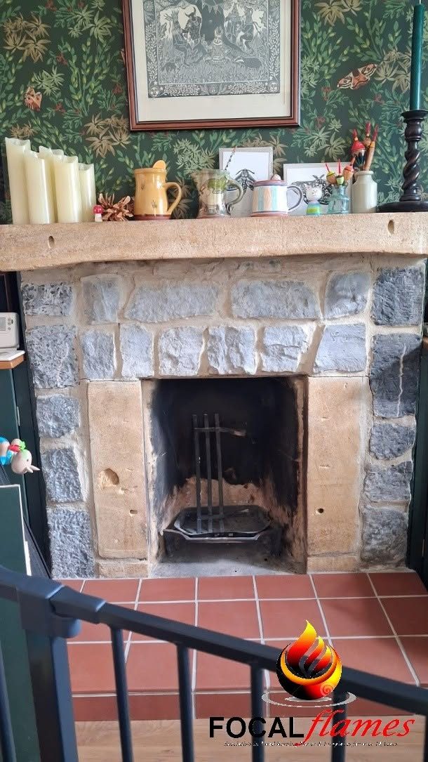 Before: an old open fire with a stone surround and tiled hearth