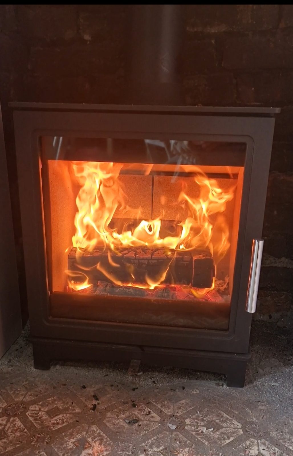 A close view of a customer's lit stove